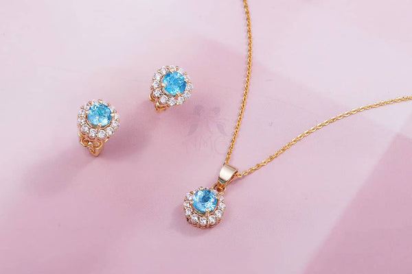 blue topaz gold halo jewelry set by AME Jewellery