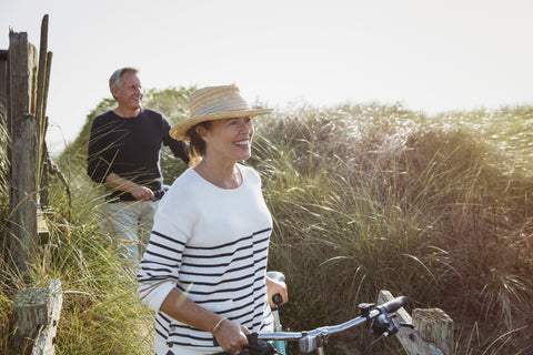 Couple walking with their bikes