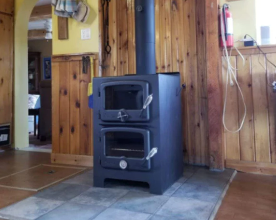 Dual Purpose Hybrid wood stove and wood oven installed in a cabin in Oregon. Wood cabin heated 