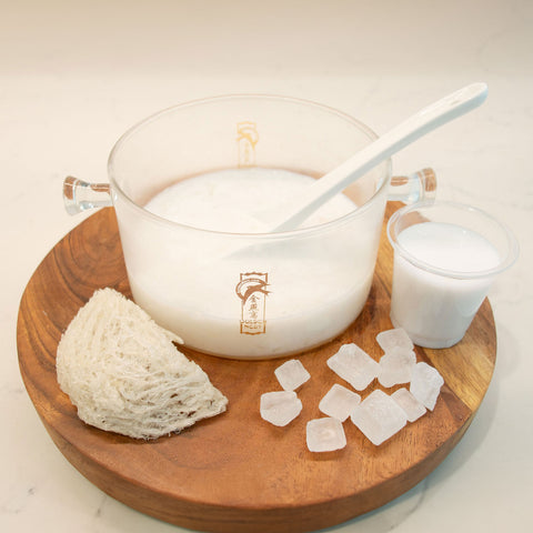 Image of glass cookware, a piece of Golden Nest's edible bird's nest, coconut milk, and rock sugar.