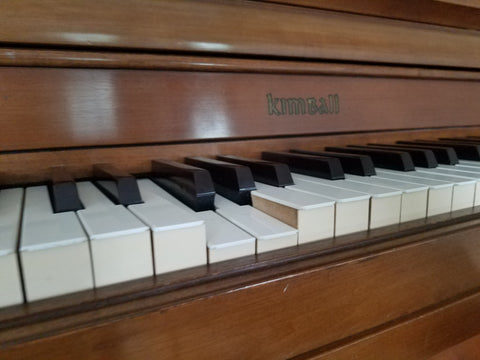 Kimball piano with two keys depressed