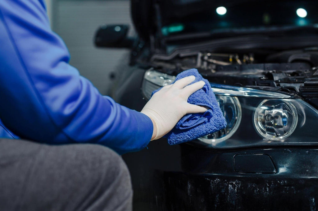 Cleaning headlight with microfiber cloth by carcarez, car lights carcarez blog image