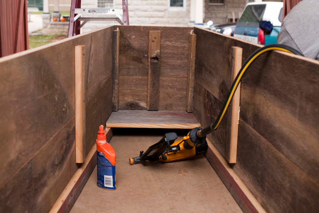 installing floorboard in casket coffin