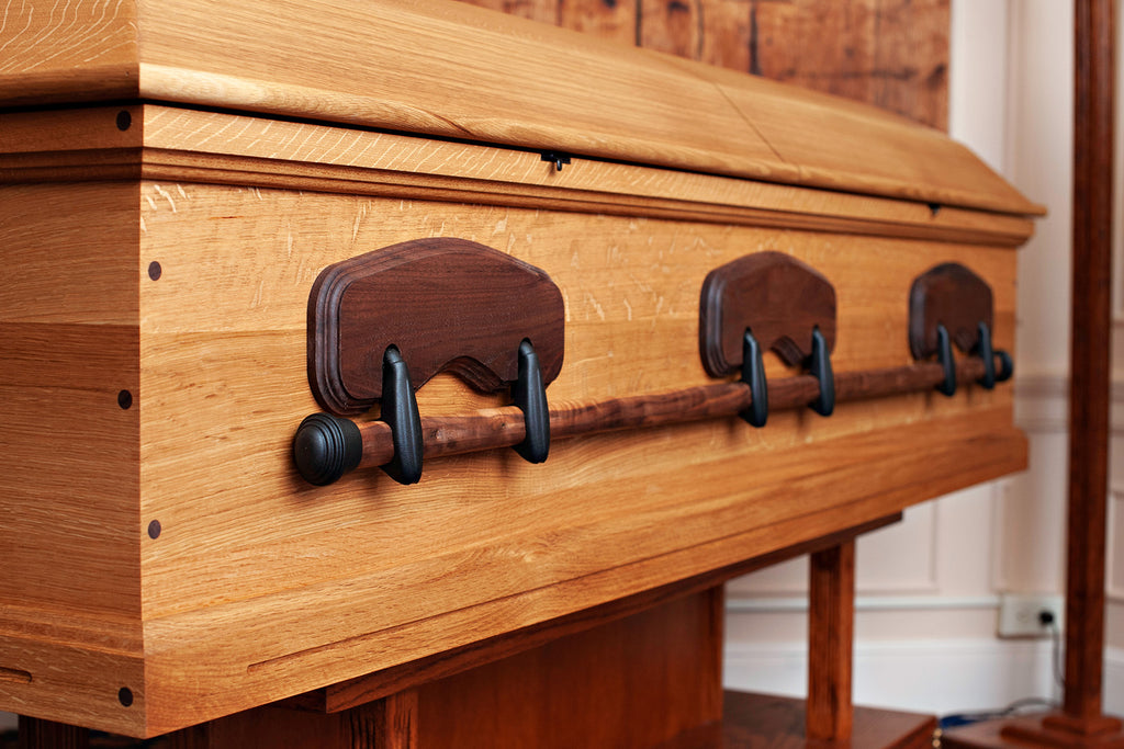 quarter sawn white oak casket with hand forged black swing bar casket hardware