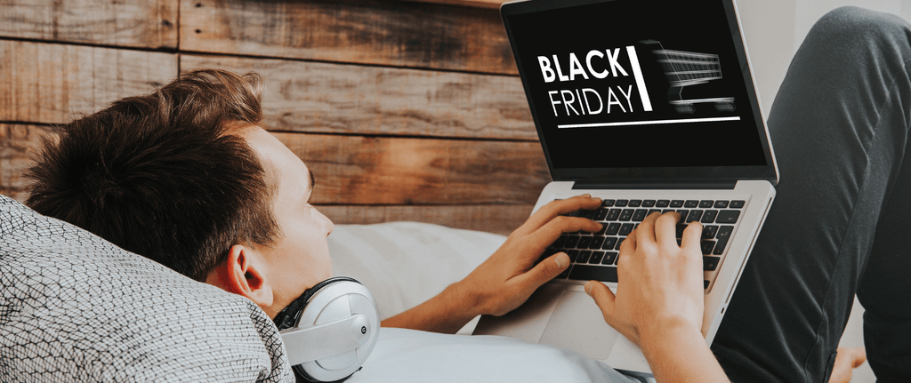 A man Black Friday shopping at home