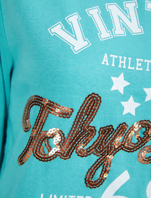 Sparked Sequin Motif Brushback Fleece Pullover Hoodie in Aqua - triatloandratx