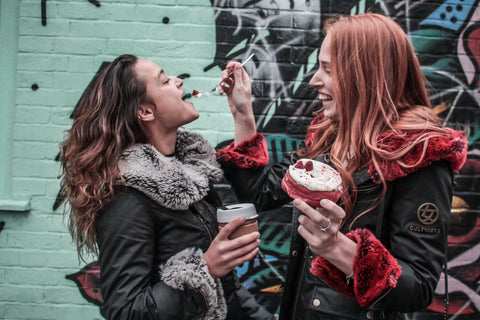 girls eating doughnut