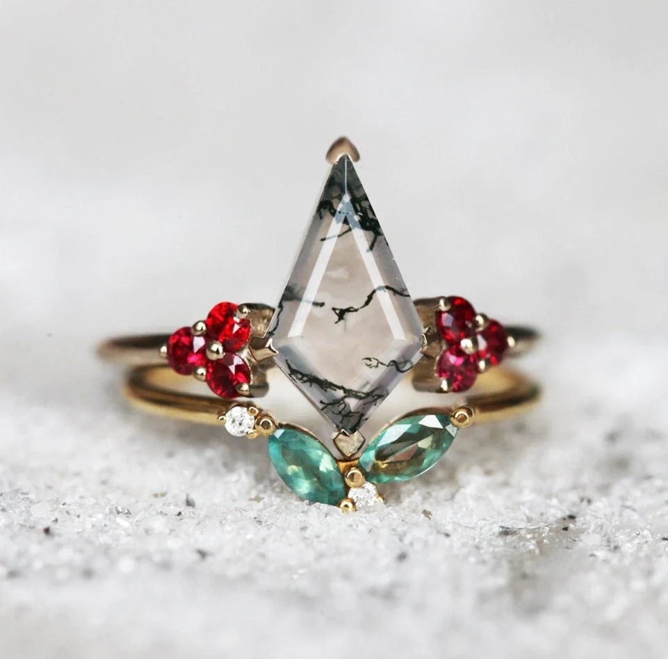 With its colors of red, white, green, and gold, the Valentina Ring Set by Capucinne makes the perfect Christmas engagement ring.