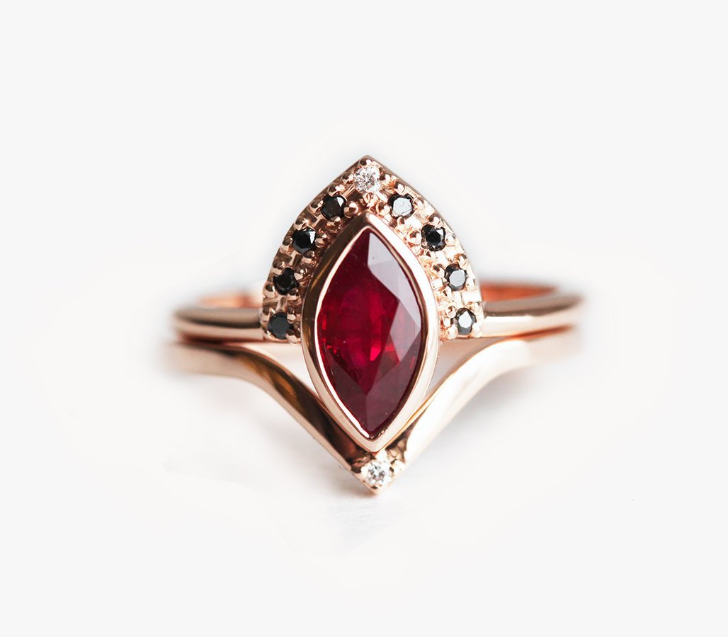 The Regina Ring Set with a marquise-cut ruby, plus black and white diamonds