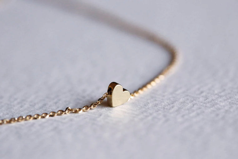 A delicate heart necklace by Capucinne makes a lovely Valentine’s jewelry present.
