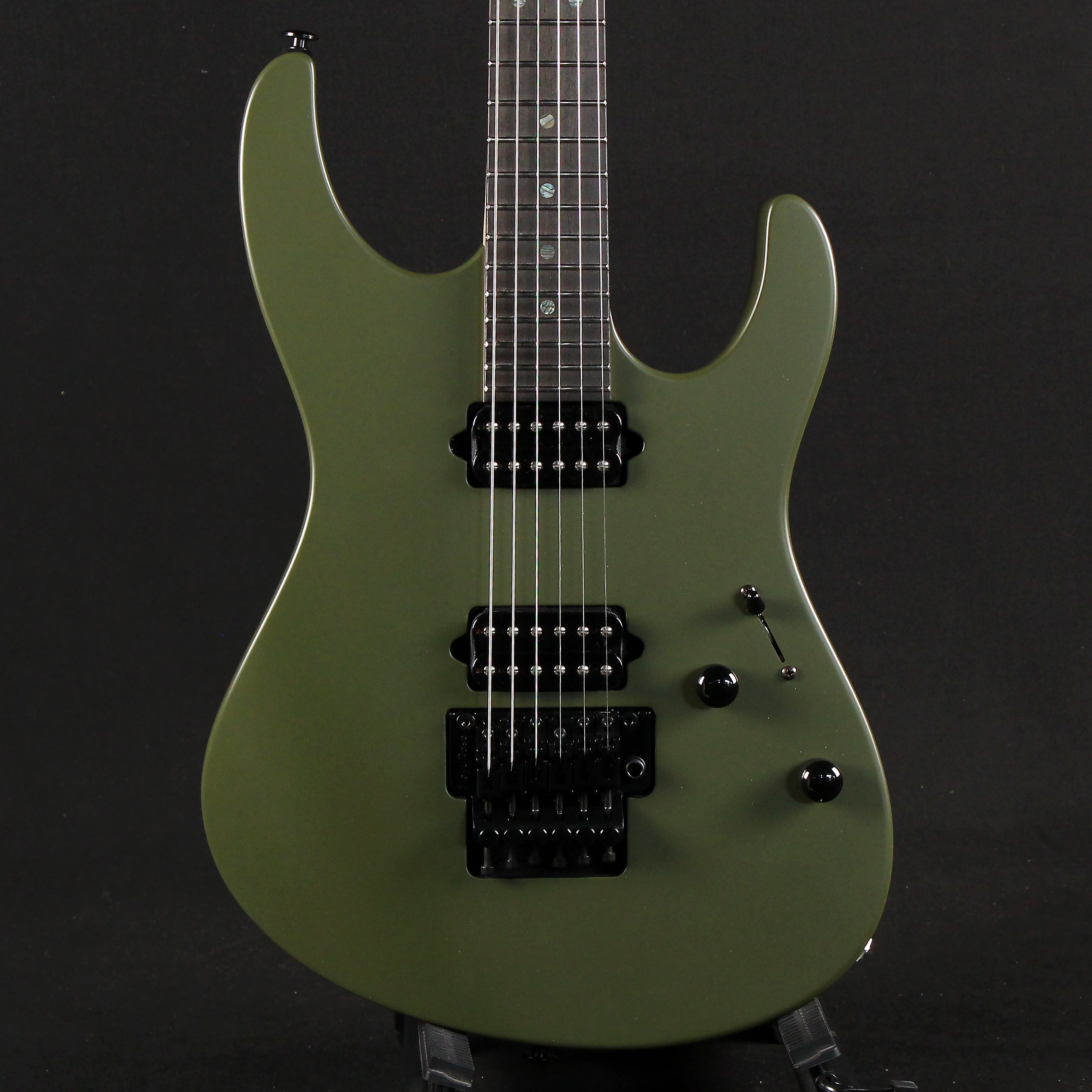 dark green electric guitar