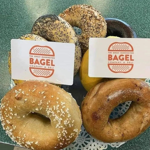 Our Top 5 Best Breakfast Spots in Great Barrington, Massachusetts. A delicious plate of bagels and gift cards reading "Great Barrington bagel company"