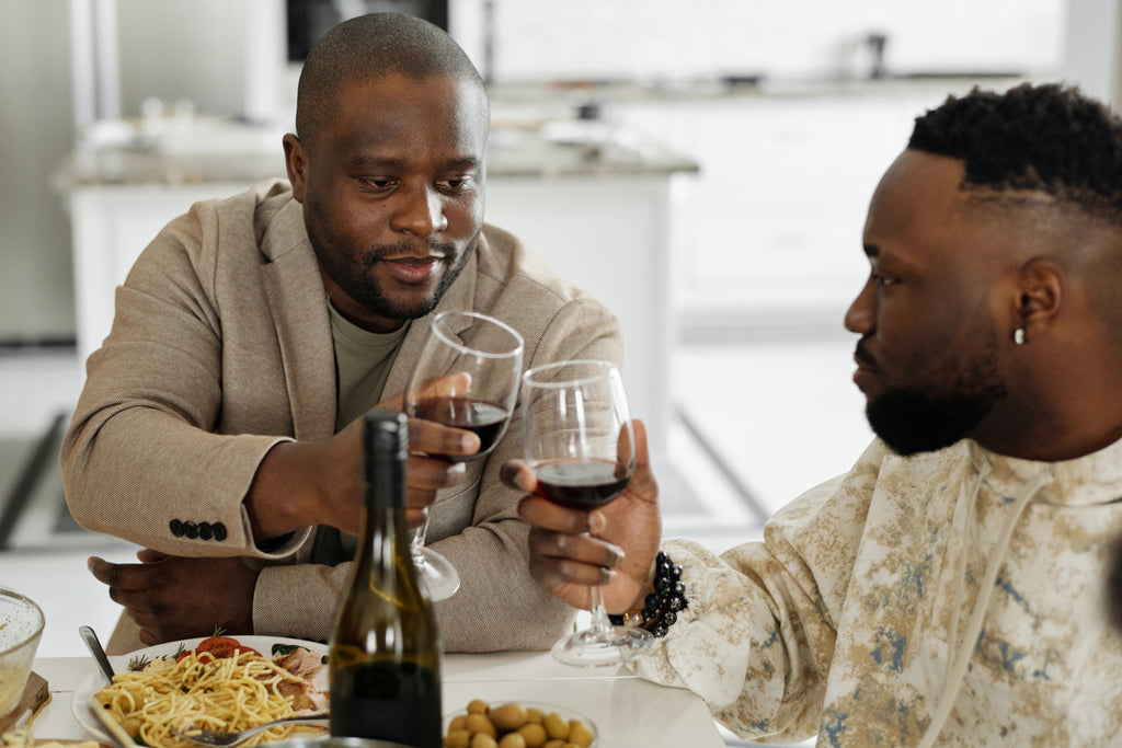 African American men drinking wine from glasses, friends party, gathering guests, how to open a bottle of wine