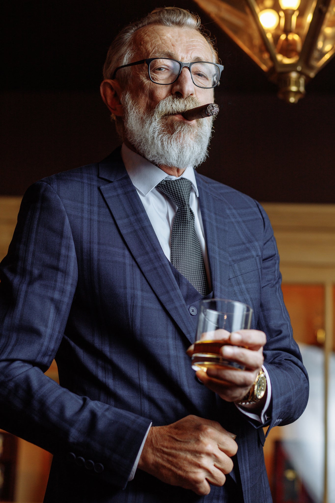The man relaxes and drinks whiskey from a shatterproof whiskey glass, tritan glasses. Glasses for restaurants, beach resorts, yachts, golf courses and cruises