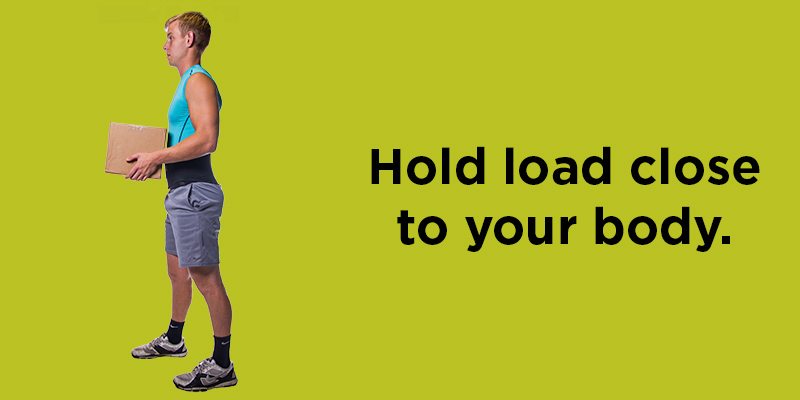 Hold loads close to your body when carrying heavy items at work