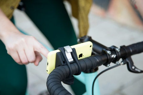 rubber phone holder that wraps around your handlebars that secures any device