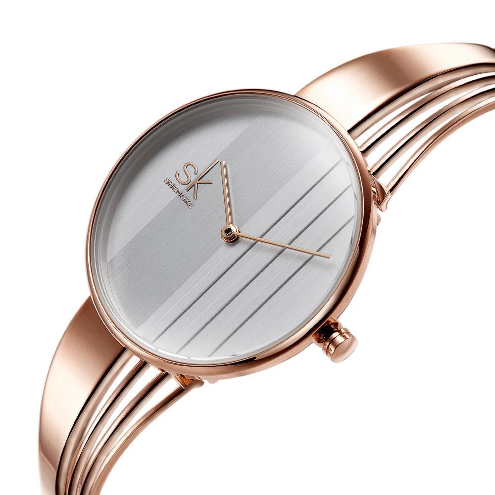 SK New Style Fashion Unique Gold-plated Women Watch Charm Ladies Wristwatch Hollow out Bracelet Quartz Personality Watch Women