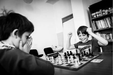 Senior man planning his next chess move, Stock image