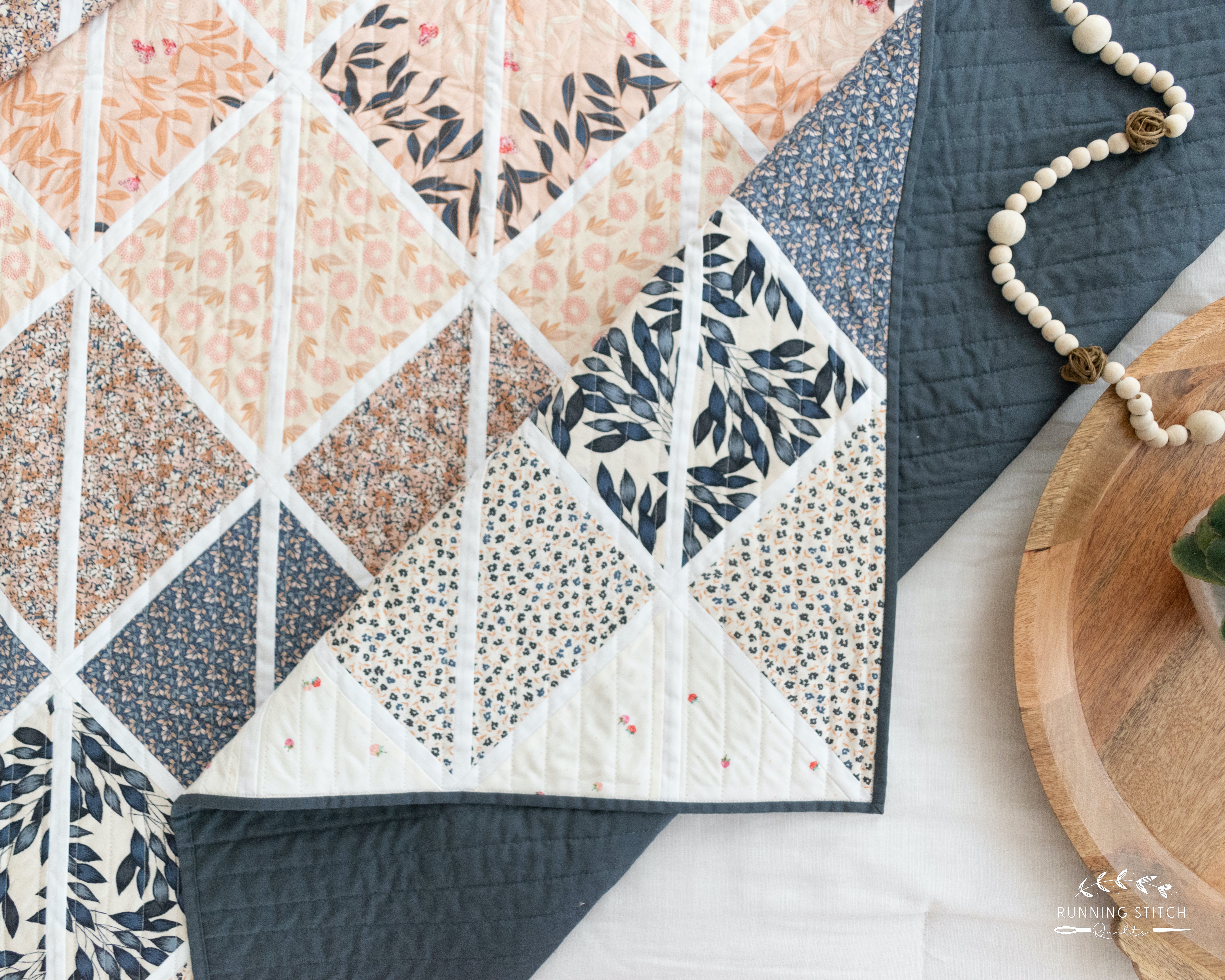 Deltille - The Haven One. A modern quilt showcasing the soft tones of an Art Gallery Fabrics quilting fabric collection.