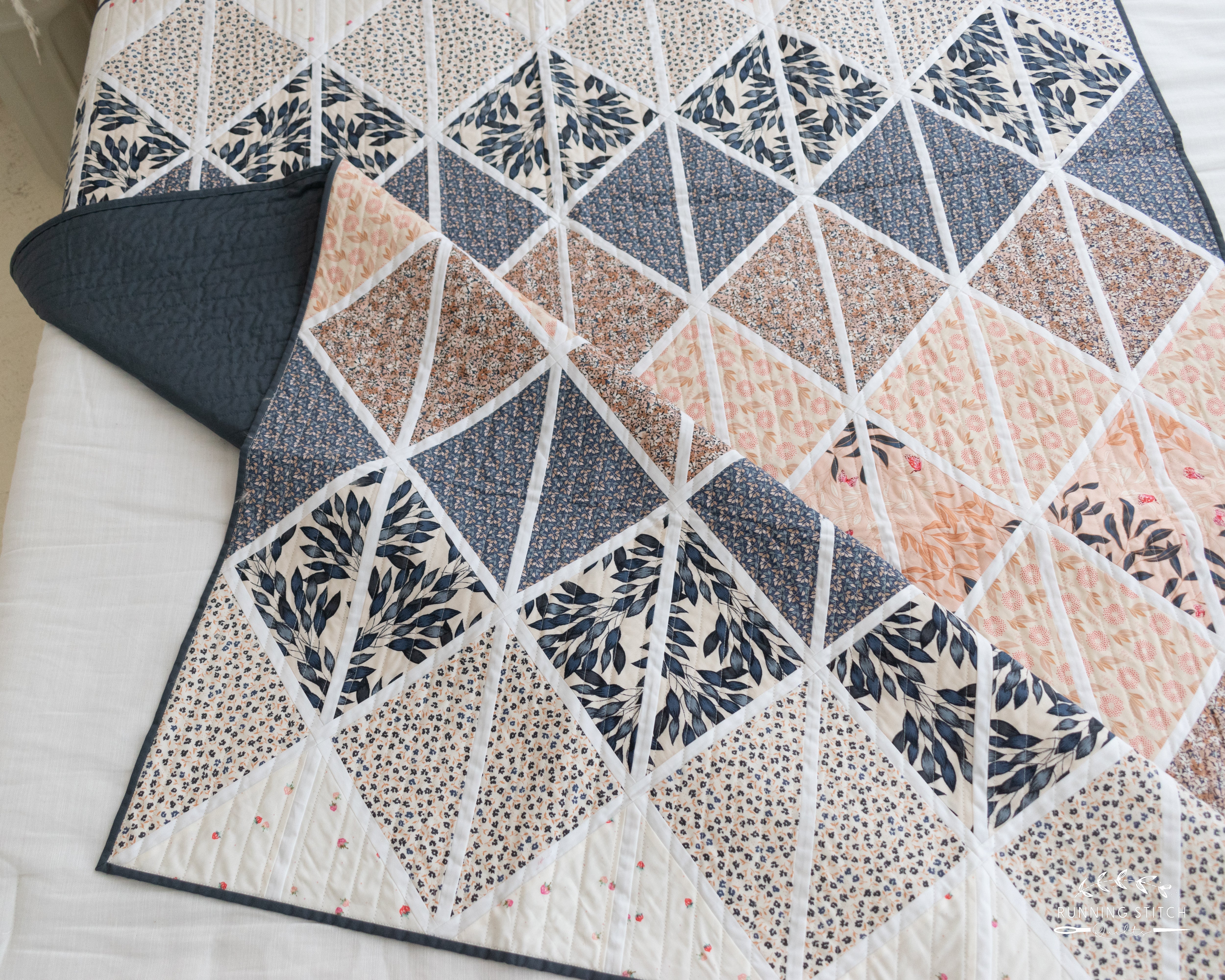 Deltille - The Haven One. A modern quilt showcasing the soft tones of an Art Gallery Fabrics quilting fabric collection.