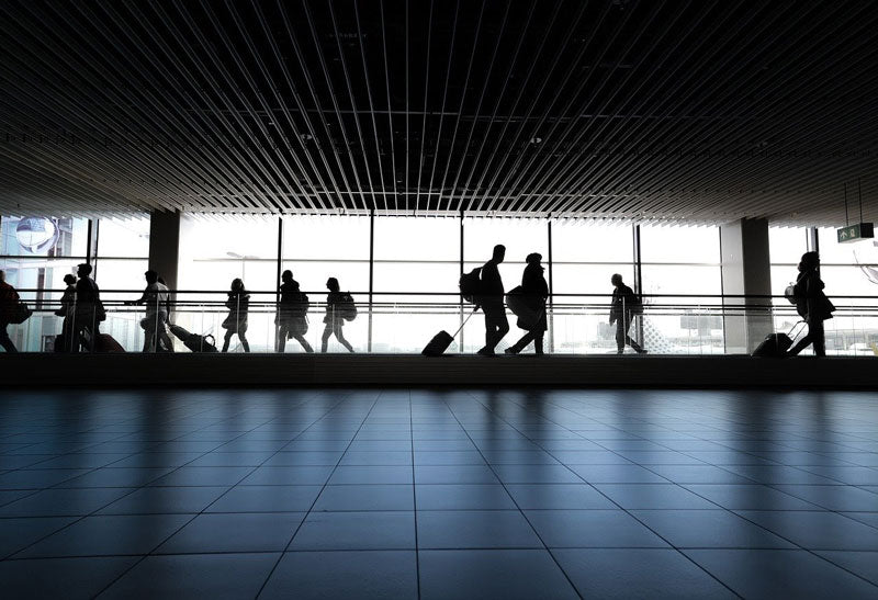 silhouette of people in airport