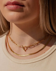 girl wearing gold herringbone necklace