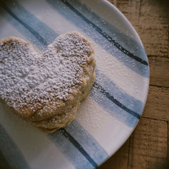 heart shaped pancake with icing sugar