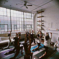 groups of women in a yoga class