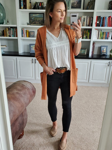 copper waffle knit cardigan, white boho blouse, black denim, studded tan loafers