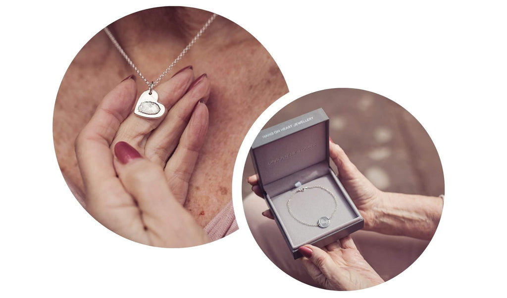 A lady being given a Memorial Fingerprint Silver Heart Necklace as a gift