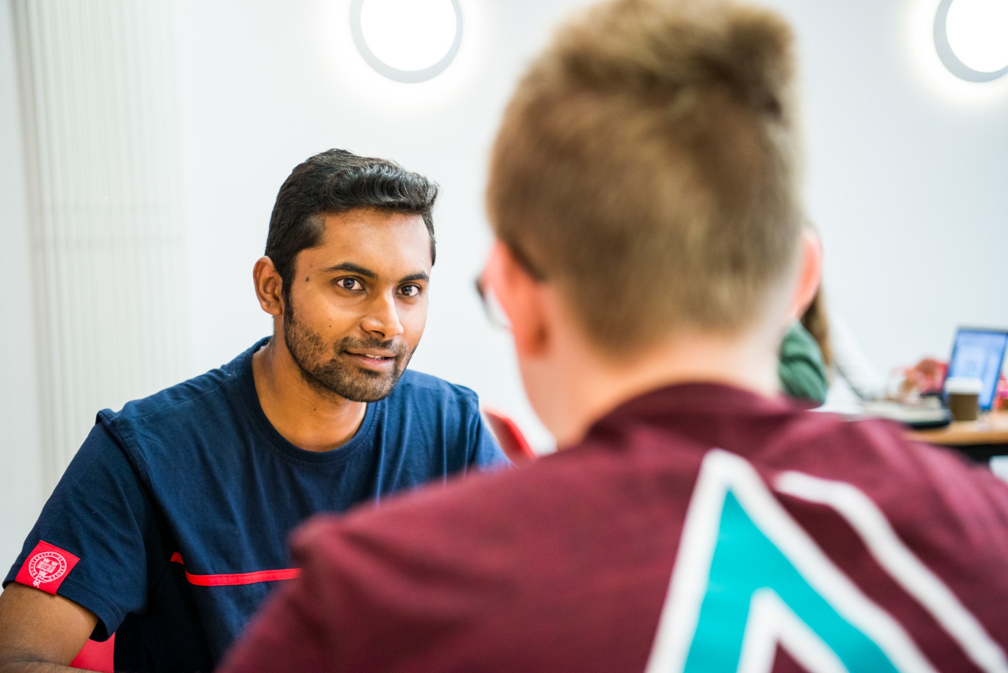 Tutor helps a student with their oxbridge practice assessment