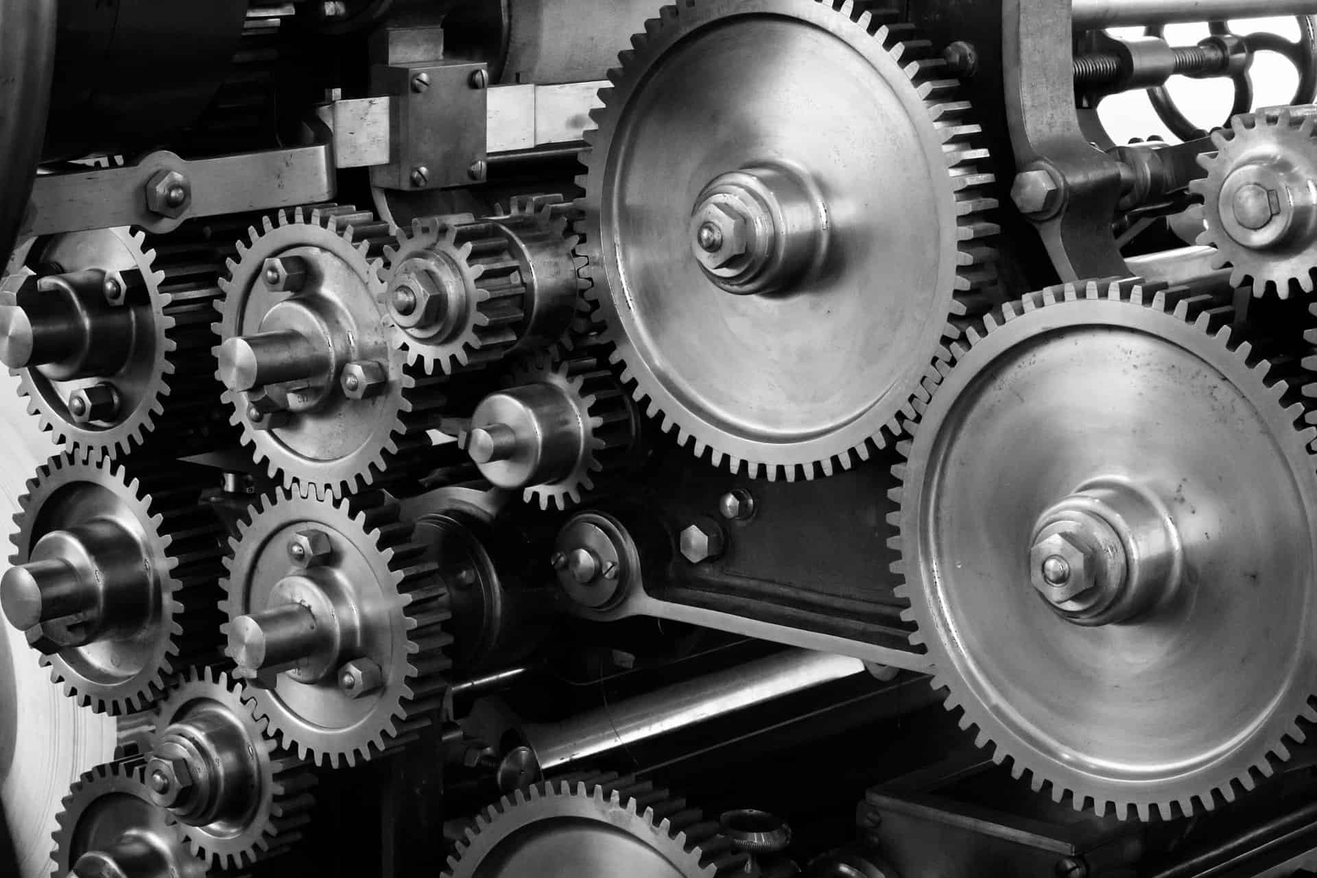 A black and white image of gears turning - you will explore engineering at Oxford and Cambridge