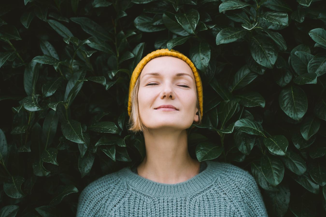 a girl smiling in front of a bush energy field energy medicine energy work energy medicine