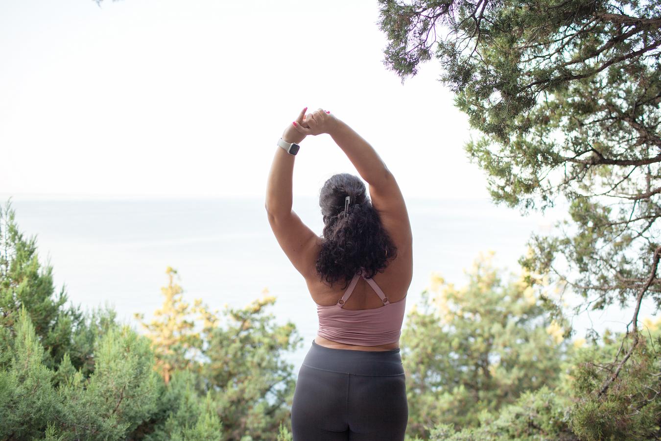 a girl stretching outdoors spend time reusable bags environment nature aware environmentally environmentally aware