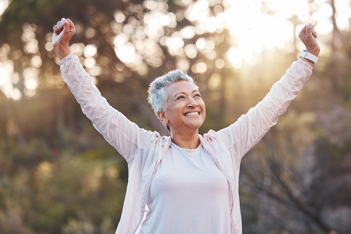 a lady stretching and smiling in the sun sore throat rat spermatogenesis process galangal flowers stomach ulcers