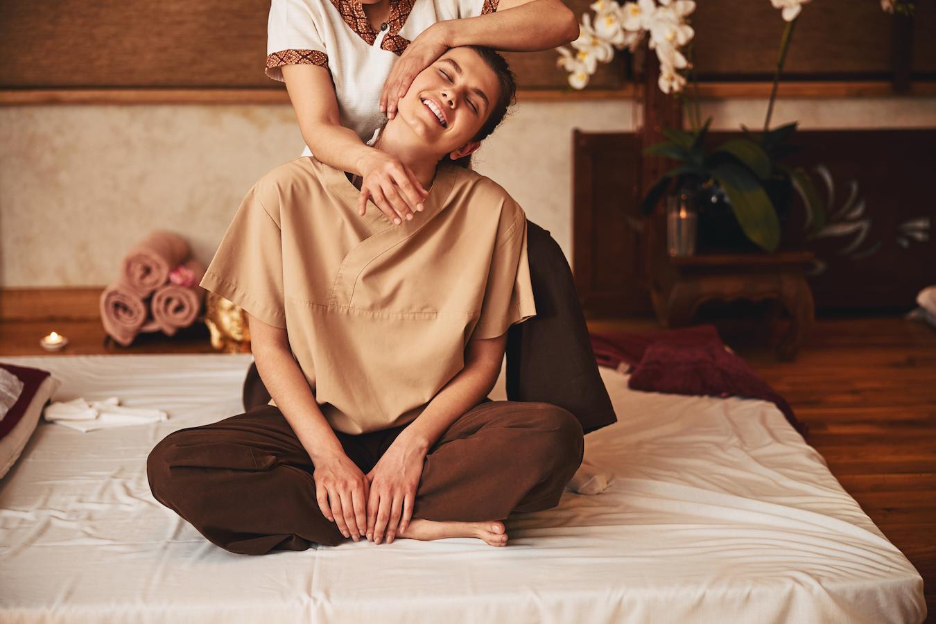 a woman getting a thai massage apply pressure oxygen supply thailand massages lowers stress father doctor
