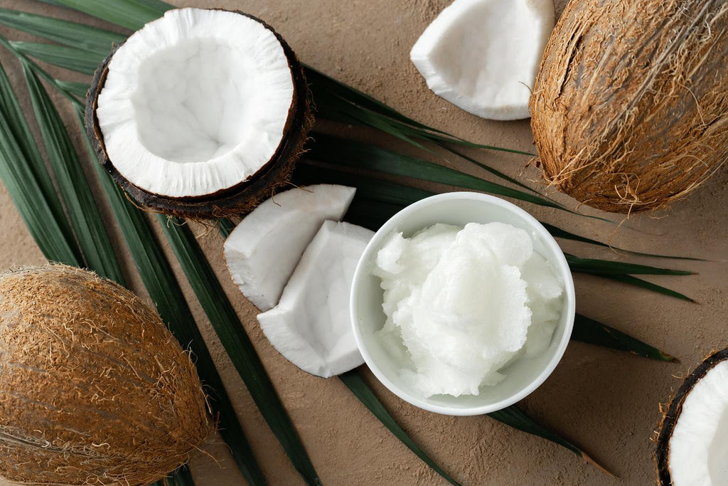 coconuts cut open on a table coconut oil for skin body lotion extra virgin coconut oil olive oil adding coconut oil for skin dead skin cells pure coconut oil for skin