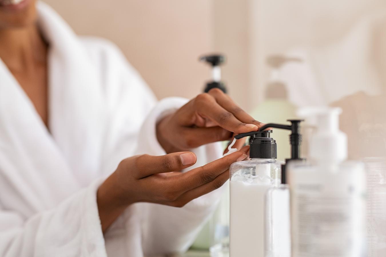 girl applying moisturizer from a dispenser skin care dead skin type skin conditions skincare routine skin irritation