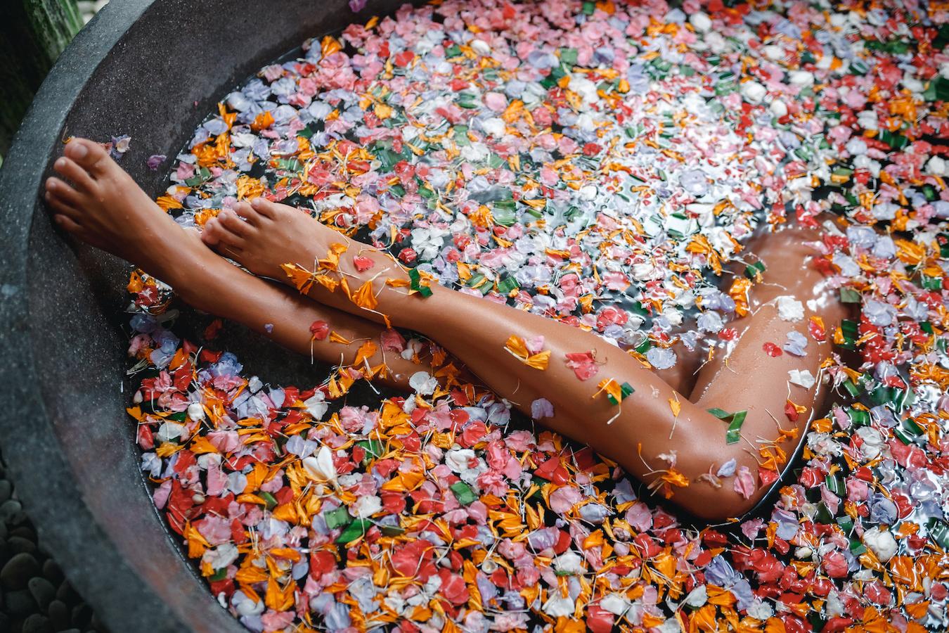 girl taking a bath with petals integrative medicine naturopathic doctor healthcare professionals herbal supplements conventional treatments