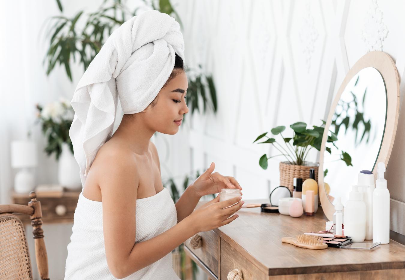 girl wearing a towel doing her skincare routine brightens complexion amla oil aloe vera amla fruit extract amla juice benefits amla benefits amla juice vitamin c amla powder skin amla benefits amla consumption