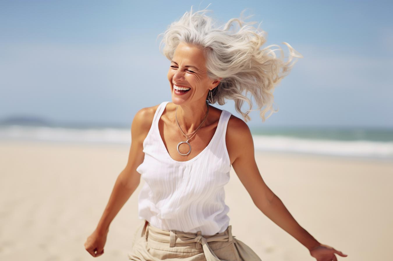 older woman smiling in the sun outside glowing skin topical vitamin e skin conditions skin health topical vitamin e skin health skin health