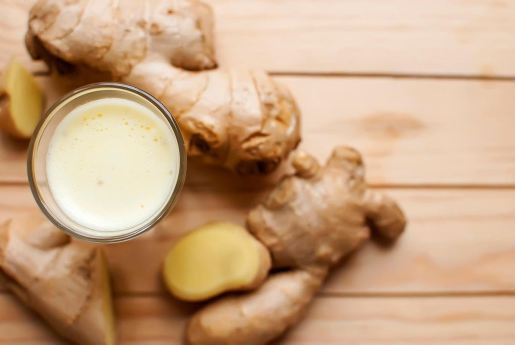 raw ginger root on a counter with juice milder flavor weight loss fresh ginger oil eat ginger water blood sugar eat ginger ale pickled ginger juice lemon ginger tea anti inflammatory eat ginger helps