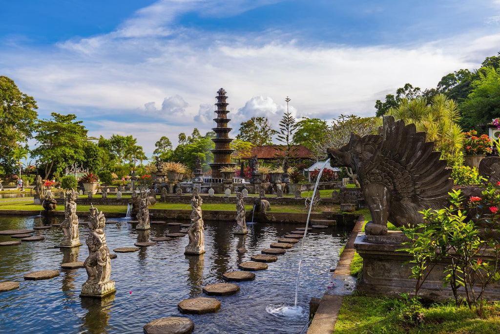 statues sitting in a pond surrounded by greenery local people malaysia geographical names total islands eastern part central team international court marine affairs largest island all the islands major islands capital city maritime territory indonesia new guinea