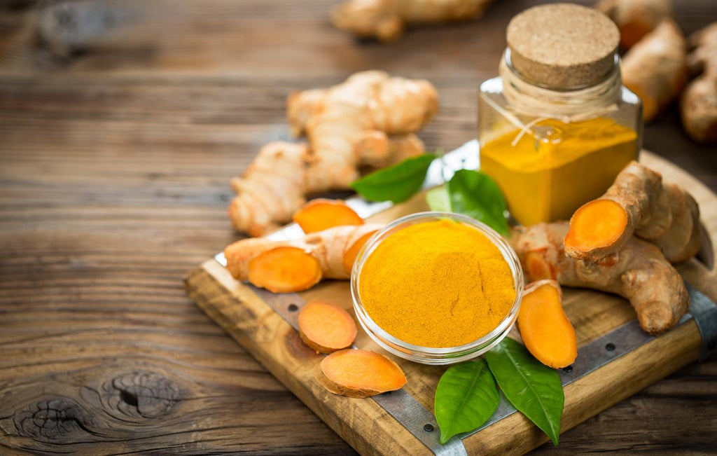 turmeric cut up on a wooden countertop brain function dietary supplements improve brain function cognitive function more research ayurvedic medicine ldl cholesterol turmeric ginger tea