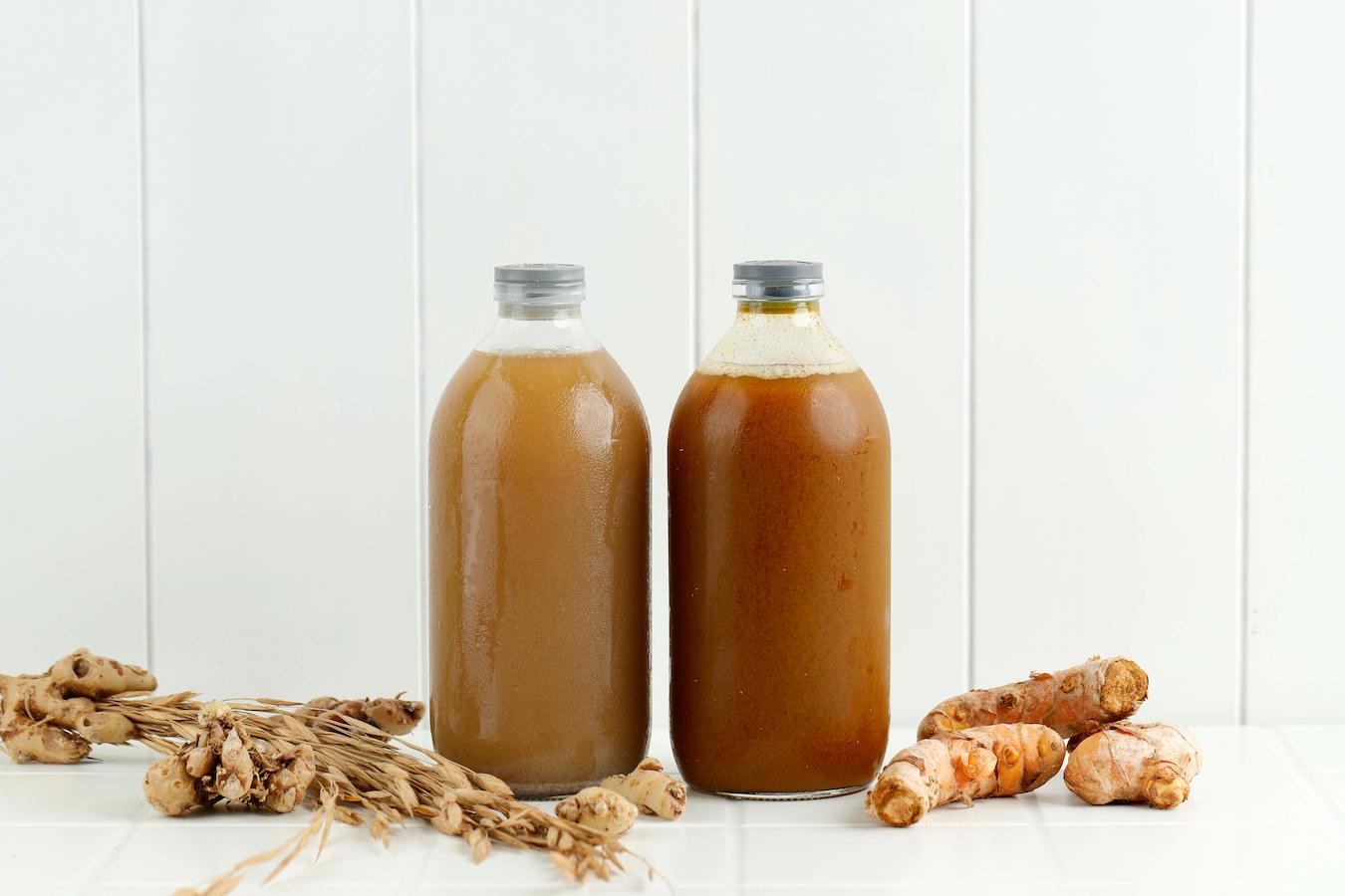 two bottles of jamu concentrate salad dressings take turmeric hot beverage more research