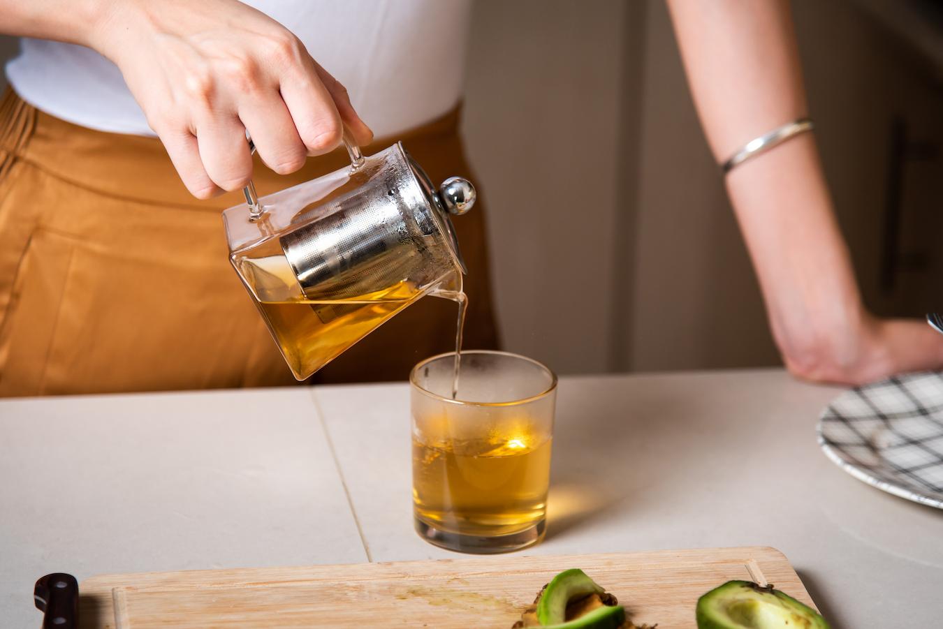 woman pouring tea from a teapot quality sencha few months leaf oxidation process enjoyed hot water japanese sencha