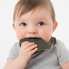 Baby chewing on BooginHead bandana teether bib in green camo pattern