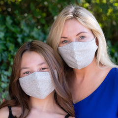 Mom and daughter wearing matching BooginHead gray face masks