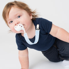 Baby using PaciGrip silicone blue bubbles
