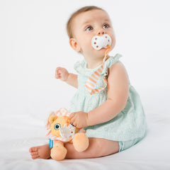 Baby using BooginHead PaciPal & PaciGrip pacifier clips